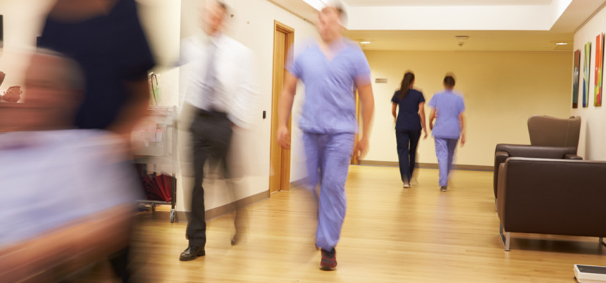 hospital staff walking in corridor