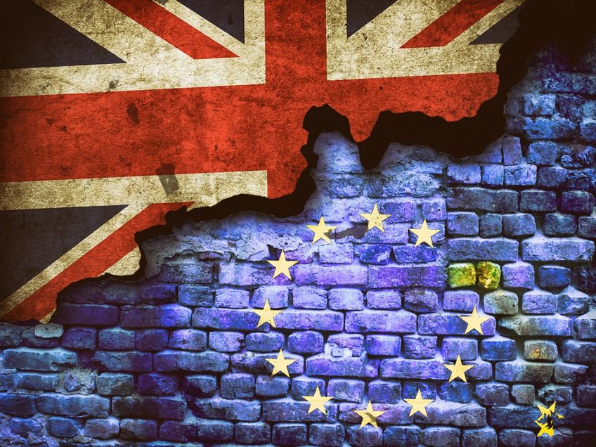 brick wall with half eu flag overlay and half union jack overlay