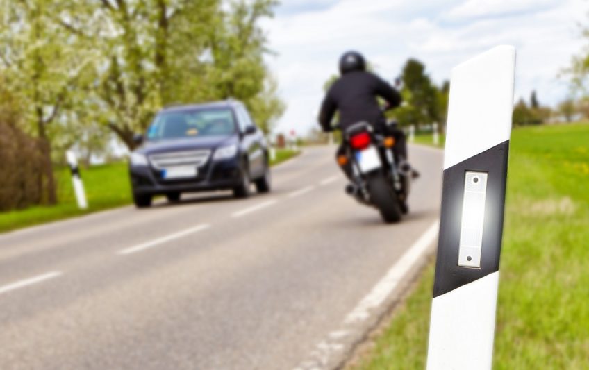 Motorbike and car - focus on foreground