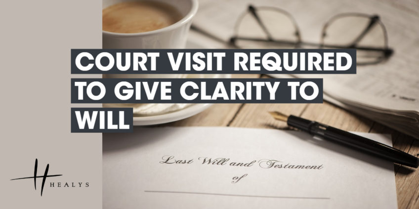 last will and testament document, with glasses, a pen and cup of tea n the table next to it