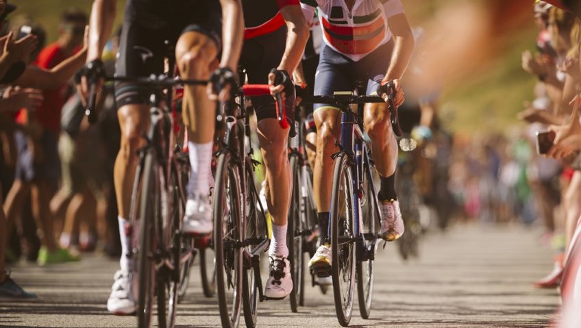 Group cyclist professional in a race.