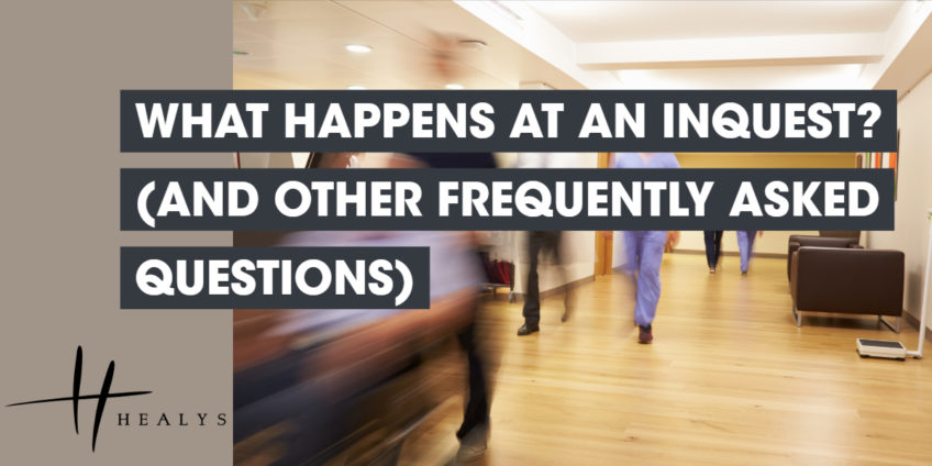 image of a hospital hallway with doctors walking through