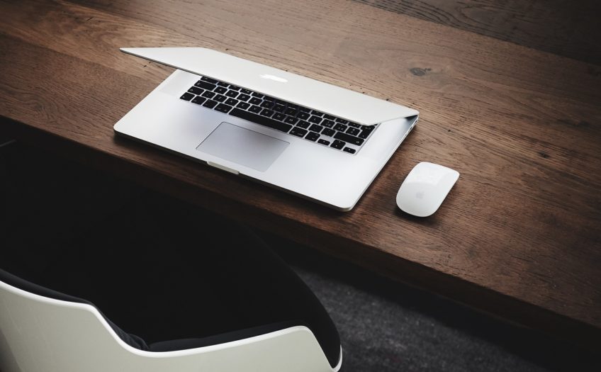 image of a laptop and mouse on a desk