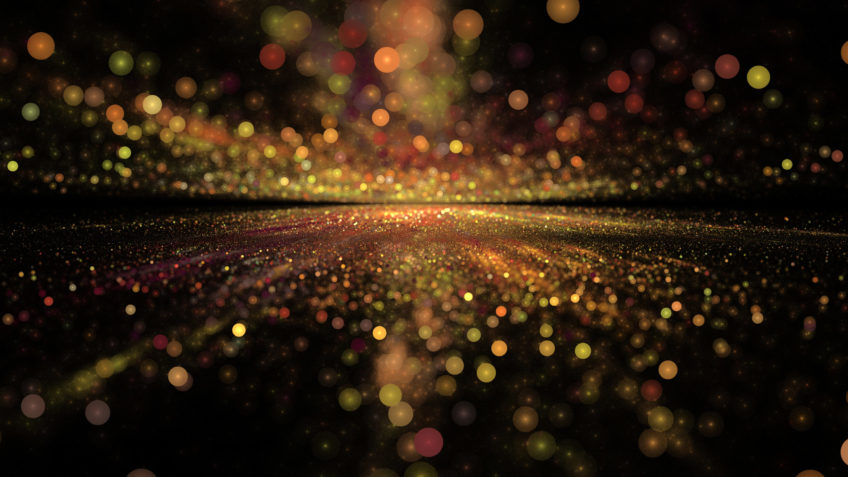 image of gold glitter against a black background