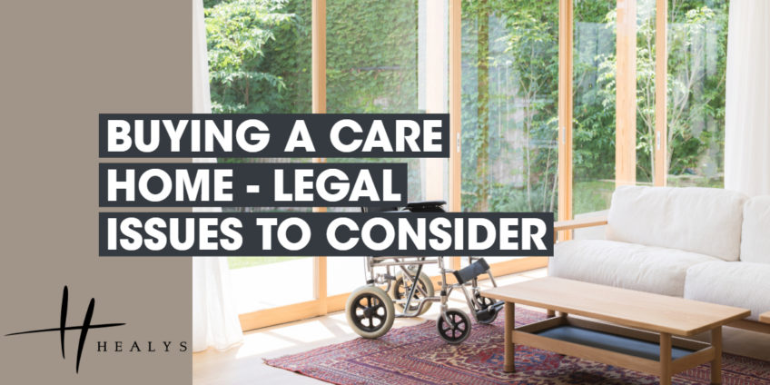 image of a room in a care home, with a sofa, table and wheelchair