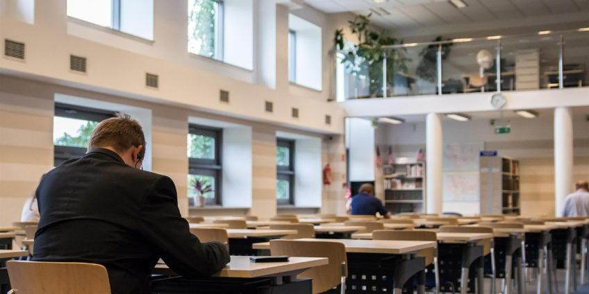 Image of people working in public library at desks