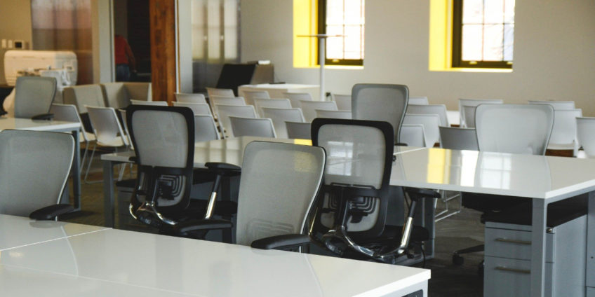 Image of empty desks and chairs in classroom