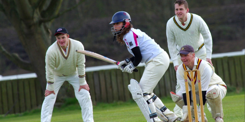 people playing cricket