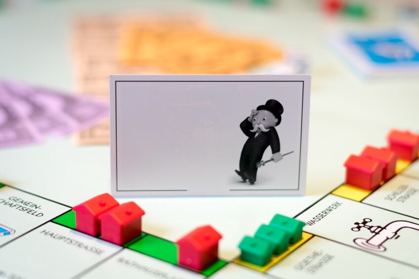 image of monopoly board with a card of mr monopoly